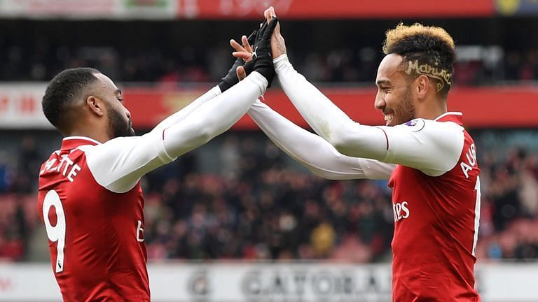 Aubameyang and Lacazette celebrate a goal together.<p>